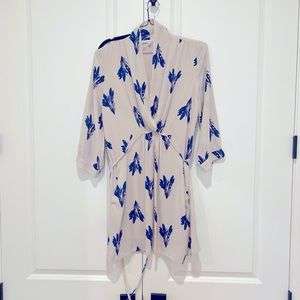 Pretty blue pattern on this tan blouse.